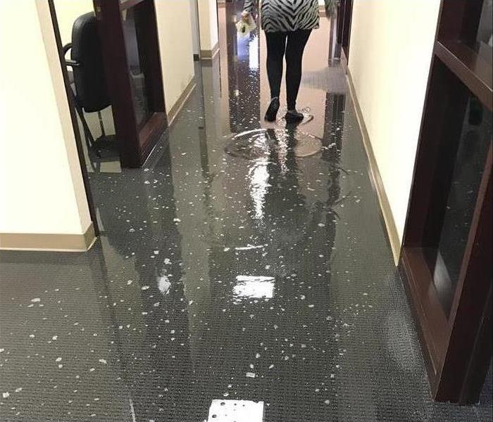 A person walking down a hallway.